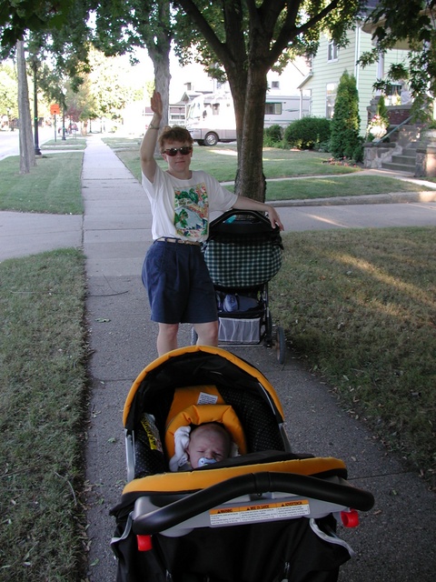 Deb waves as we go on a walk with the lil' ones...