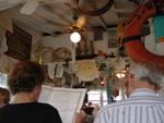 A view around the restaurant -- people draw on the paper they put down over the table.  Check out the cool sun in the middle!