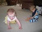 Paige tries to show Connor how to crawl.