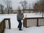 Today (4/8/03), pa built Paige-E's first snowman (with 3 carrots and some snow)... ;)  
