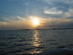 Sun is setting over the Sanibel Causeway on our way back...