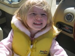 Here's big sister Paige looking up at us -- I was helping dad drive the boat and enjoying every minute of it -- until...