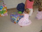 Paige-E looks over the gift Grandma Marty sent!  A brand new car! ;)  