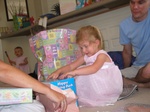 Paige decides Josie is taking too long and starts opening gifts too.