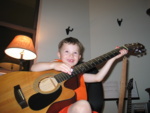 Here's another pose of Samuel jammin' on the acoustic...