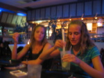 Mike taught Laura how to use chopsticks, so in this photo it looks like she's going after lemon seeds in her drink?