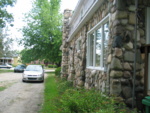 Driveway & awesome stone work on the side of the house.