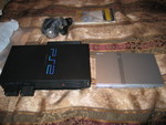 My original PS2 (on the left) finally kicked the bucket!  So I got a new one, look how much smaller it is?!   (Nope, didn't feel like waiting in line for the PS3!)
