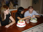 Kimmy and Adam arrange the candles while Katelyn looks on..