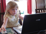 Since starting Pre-Kindergarten, and having computer class -- Josie has really been doing well with computers.  Here she concentrates as she plays one of the most addictive games on the planet -- Zuma Deluxe.