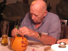 Great Papa concentrates on making his pumpkin look special!
