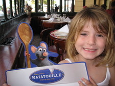 Here we are in France -- Paige holds up her Ratatouille menu!