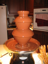 Yes, this year we've upgraded to a real, bonafide, chocolate fountain!  Yummy!  The goal for the evening was to find the most interesting 'edible' thing to dip in the chocolate!