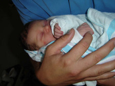Tiny baby in Big hands