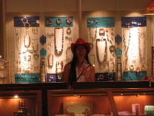 Amy tries on a cowgirl hat in a shop in Ann Arbor!