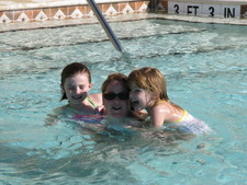 Paige, Aunt Amy and Josie say "Hi!  We're havin' fun in the pool!"