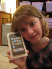 WOW!  Santa was good to Paige -- an iPod Touch!  JoJo got one too!  Loaded with educational applications and their favorite movies for our trips to Disney and to see family!