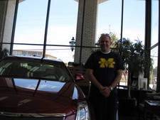 Dad's favorite car is the "Cadillac CTS", and I took this photo of him standing by one!